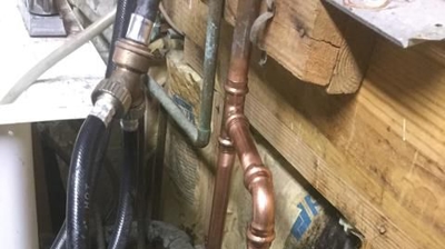 Copper Piping Replaced Behind Laundry Photo