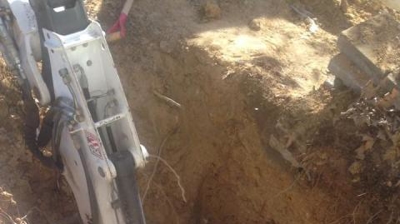 Carefully Digging for Line Repair Photo