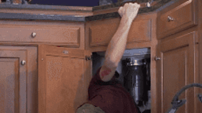 Residential kitchen garbage disposer installation in progress Photo