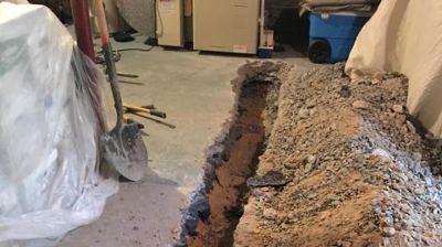 Excavation of Broken Floor Drain Photo