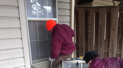 Crew digging through 10" of frozen ground in sub zero temperatures. Photo
