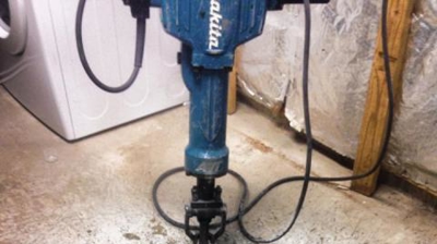 Jack hammer needed to access the broken pipe. Photo